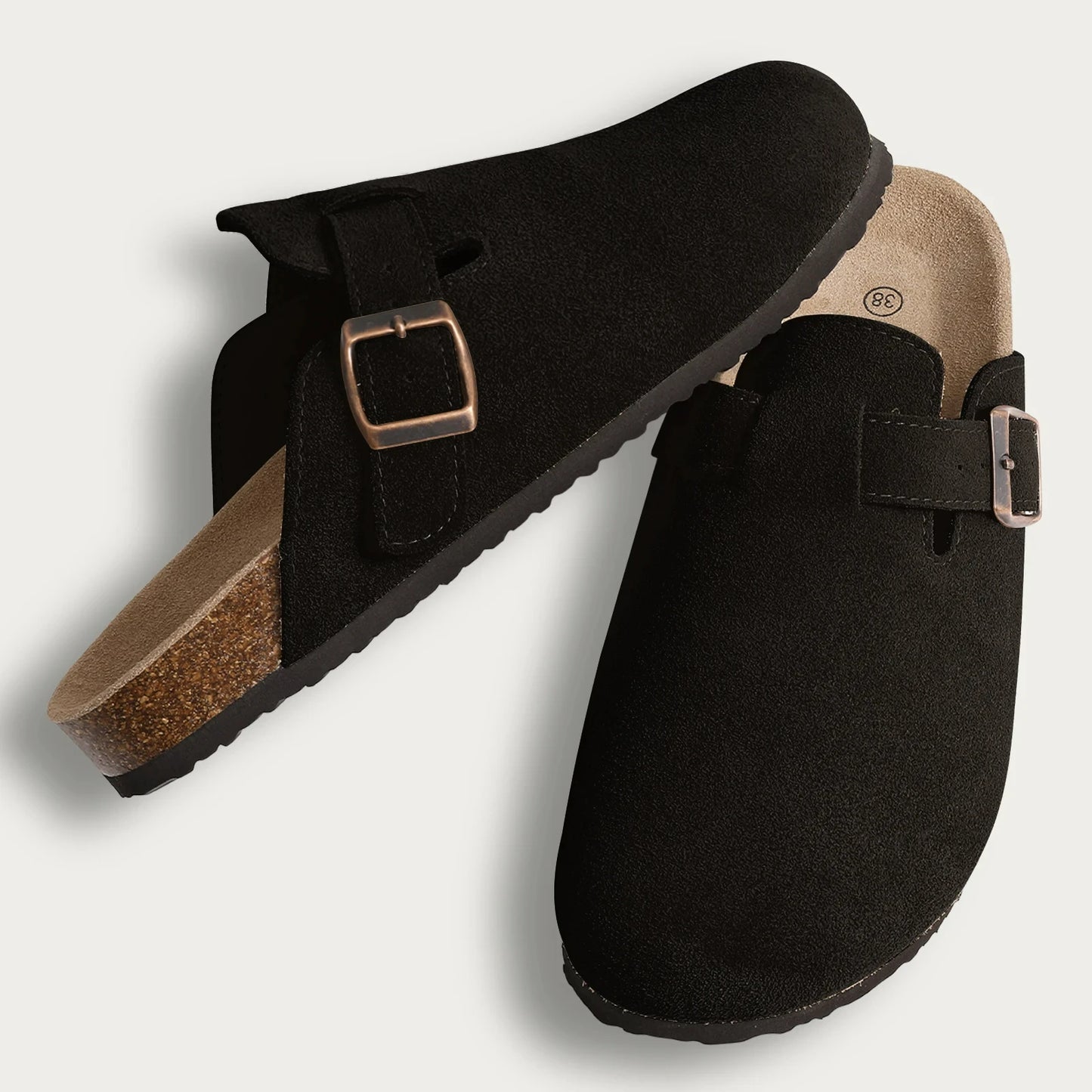 Black Bali Clogs in premium suede with a comfortable cork sole, offering a warm and stylish look for everyday wear.