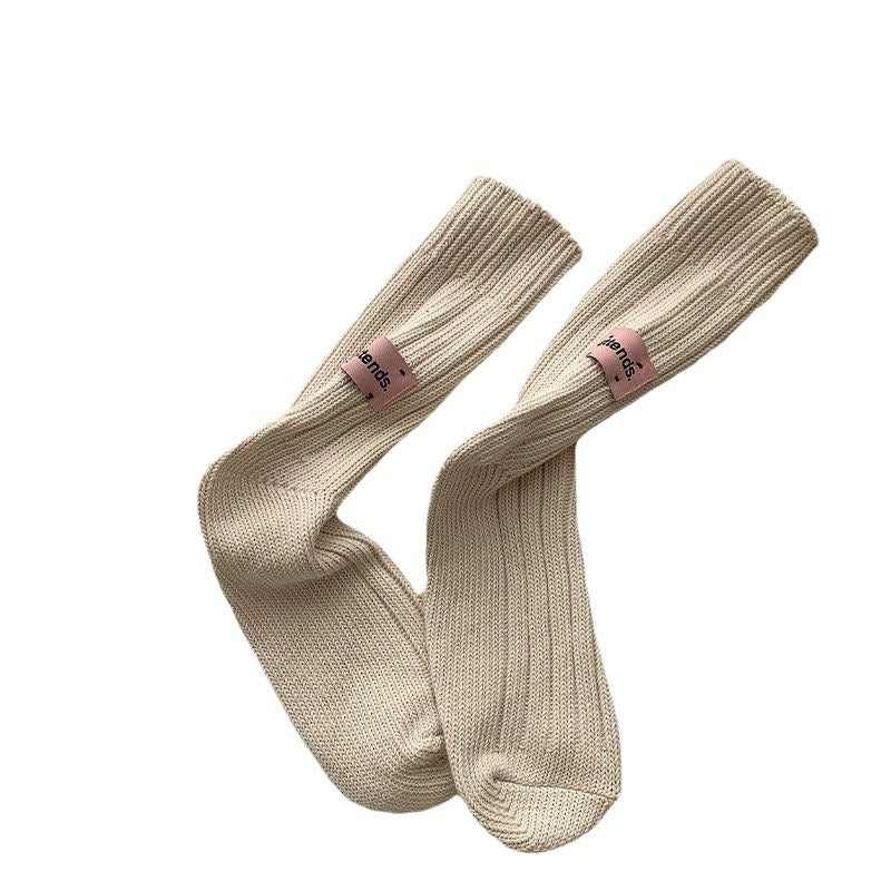 White cotton socks, soft and breathable, perfect for everyday comfort and paired with Bali Clogs.